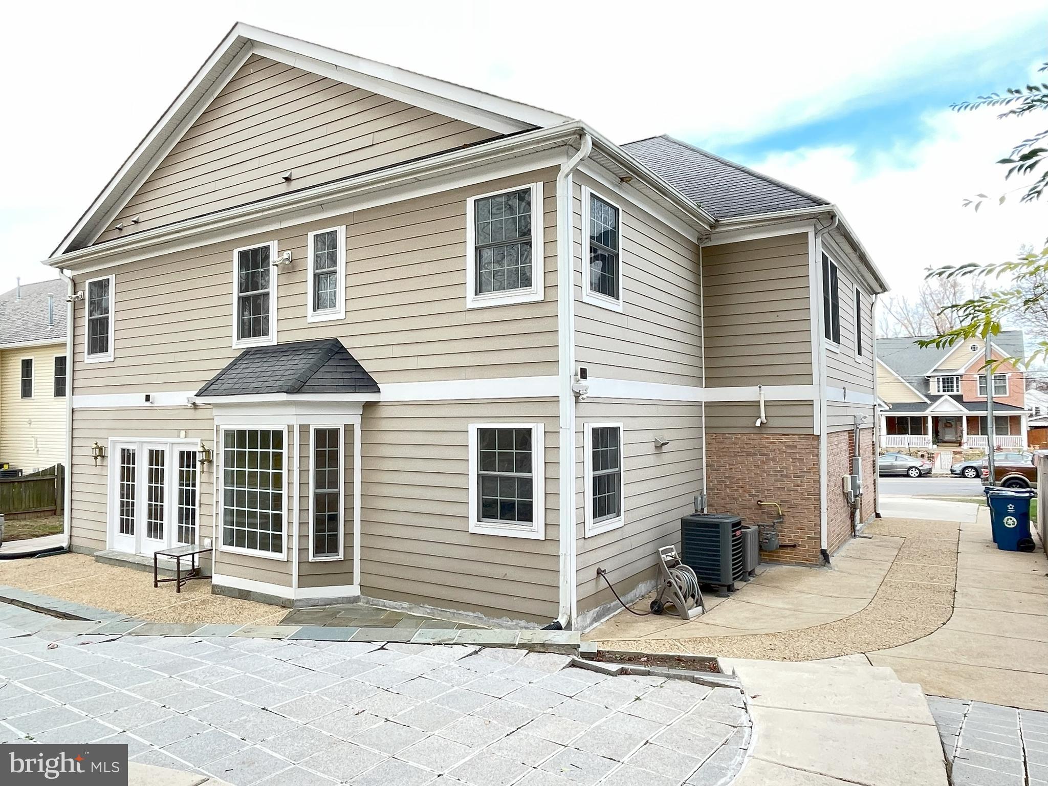 7212 Highland Street Springfield, VA 22150 - Photo 47 of 60 a view of a white house with large windows