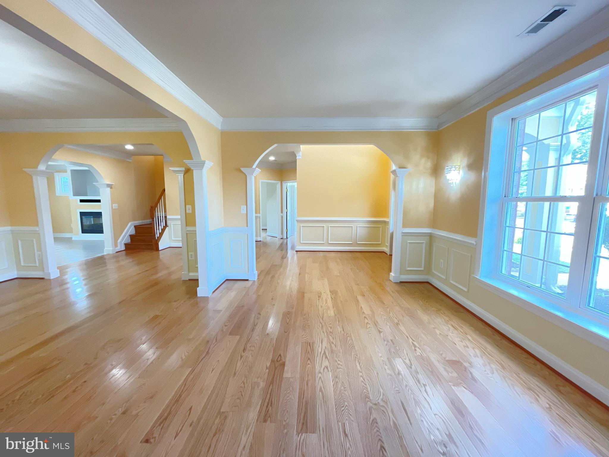 7212 Highland Street Springfield, VA 22150 - Photo 6 of 60 a view of empty room with wooden floor and fan