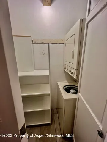 a bathroom with a tub shower vanity and a sink