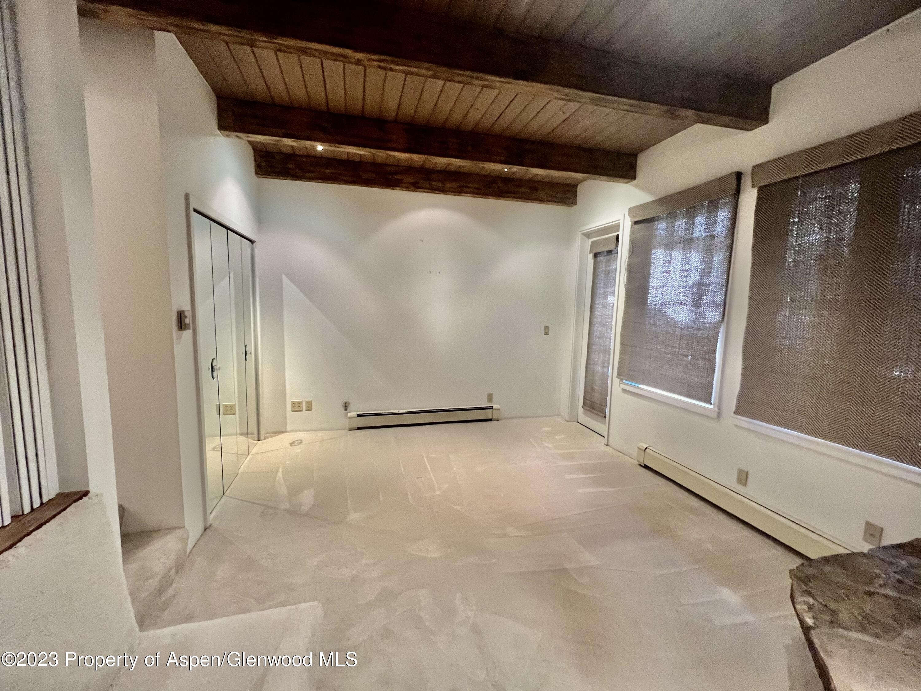 651 South Monarch Street Aspen, CO 81611 - Photo 18 of 19 a view of a room with wooden floor and windows