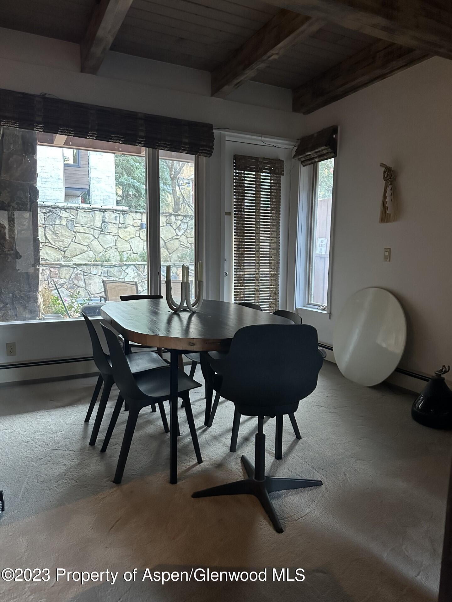 651 South Monarch Street Aspen, CO 81611 - Photo 4 of 19 a view of a dining room with furniture window and outside view