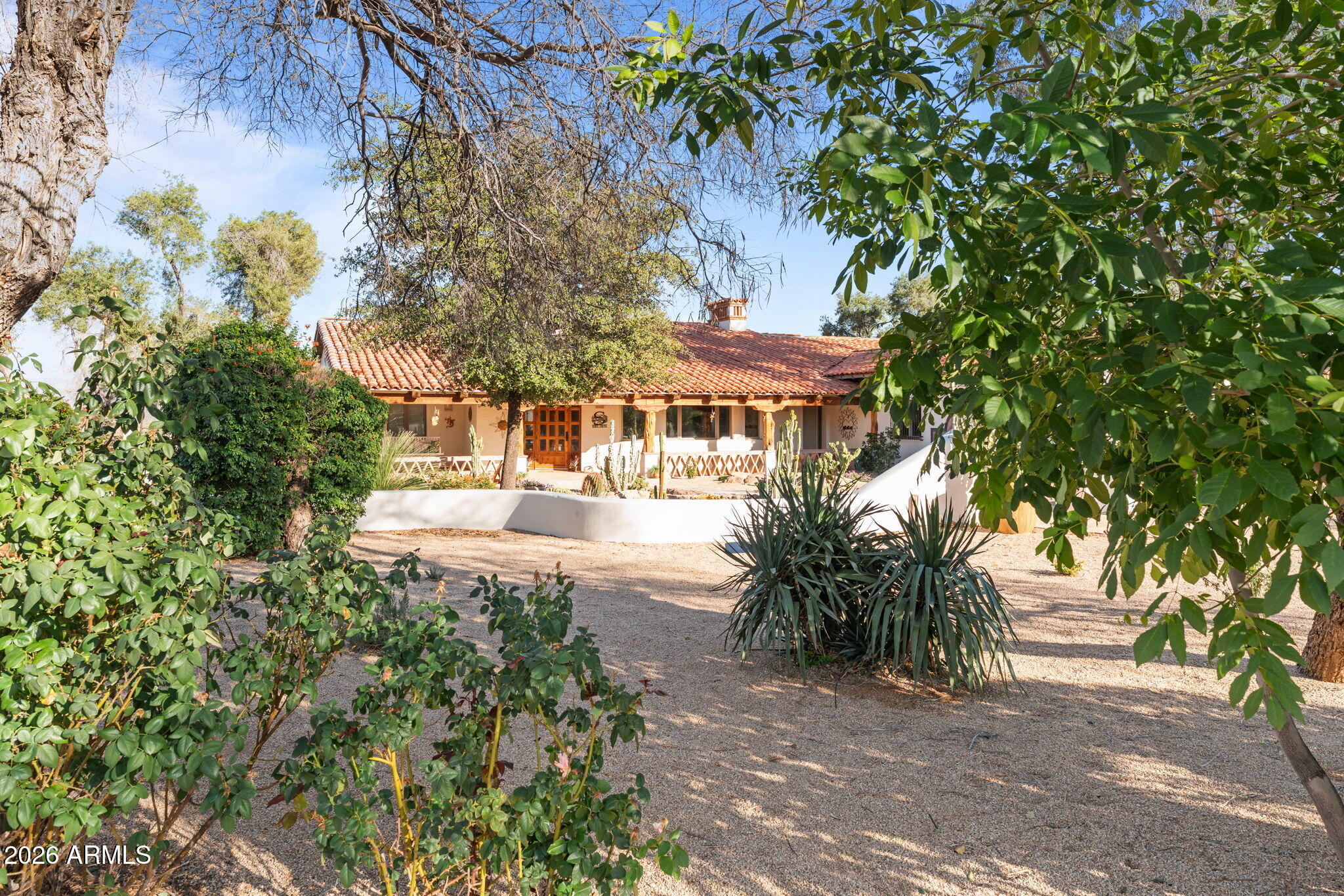 18210 Moonlight Mesa Road Wickenburg, AZ 85390 - Photo 101 of 141 a view of a house with a tree in the yard