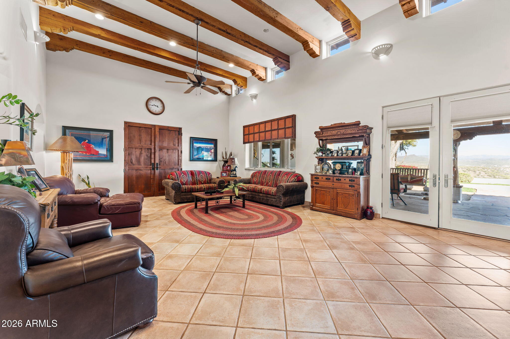 18210 Moonlight Mesa Road Wickenburg, AZ 85390 - Photo 16 of 141 a living room with furniture and a table