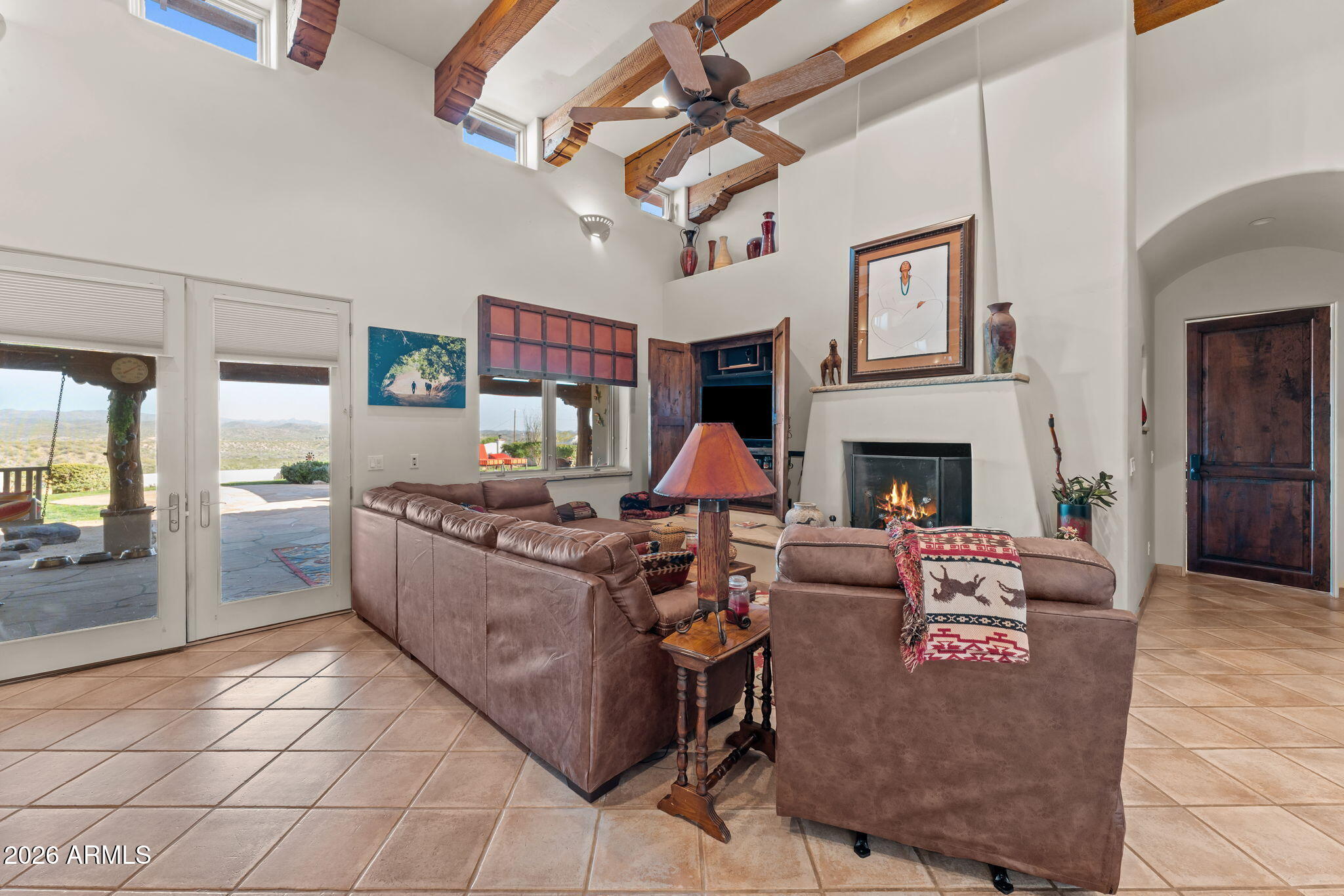 18210 Moonlight Mesa Road Wickenburg, AZ 85390 - Photo 21 of 141 a living room with furniture and a fireplace