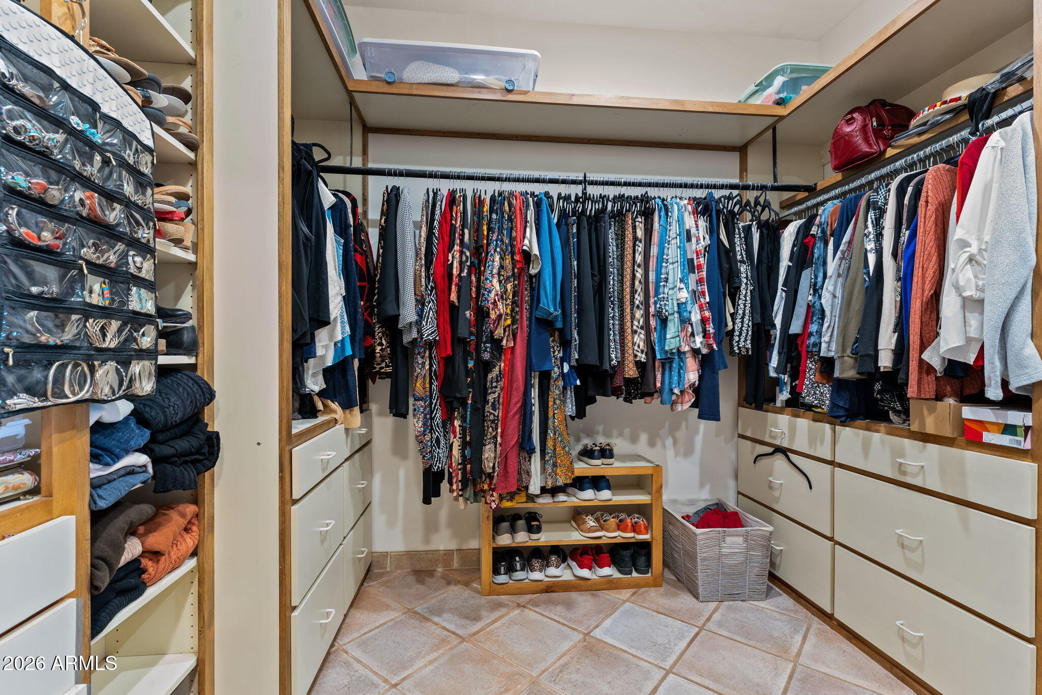 18210 Moonlight Mesa Road Wickenburg, AZ 85390 - Photo 28 of 141 a view of walk in closet with clothes