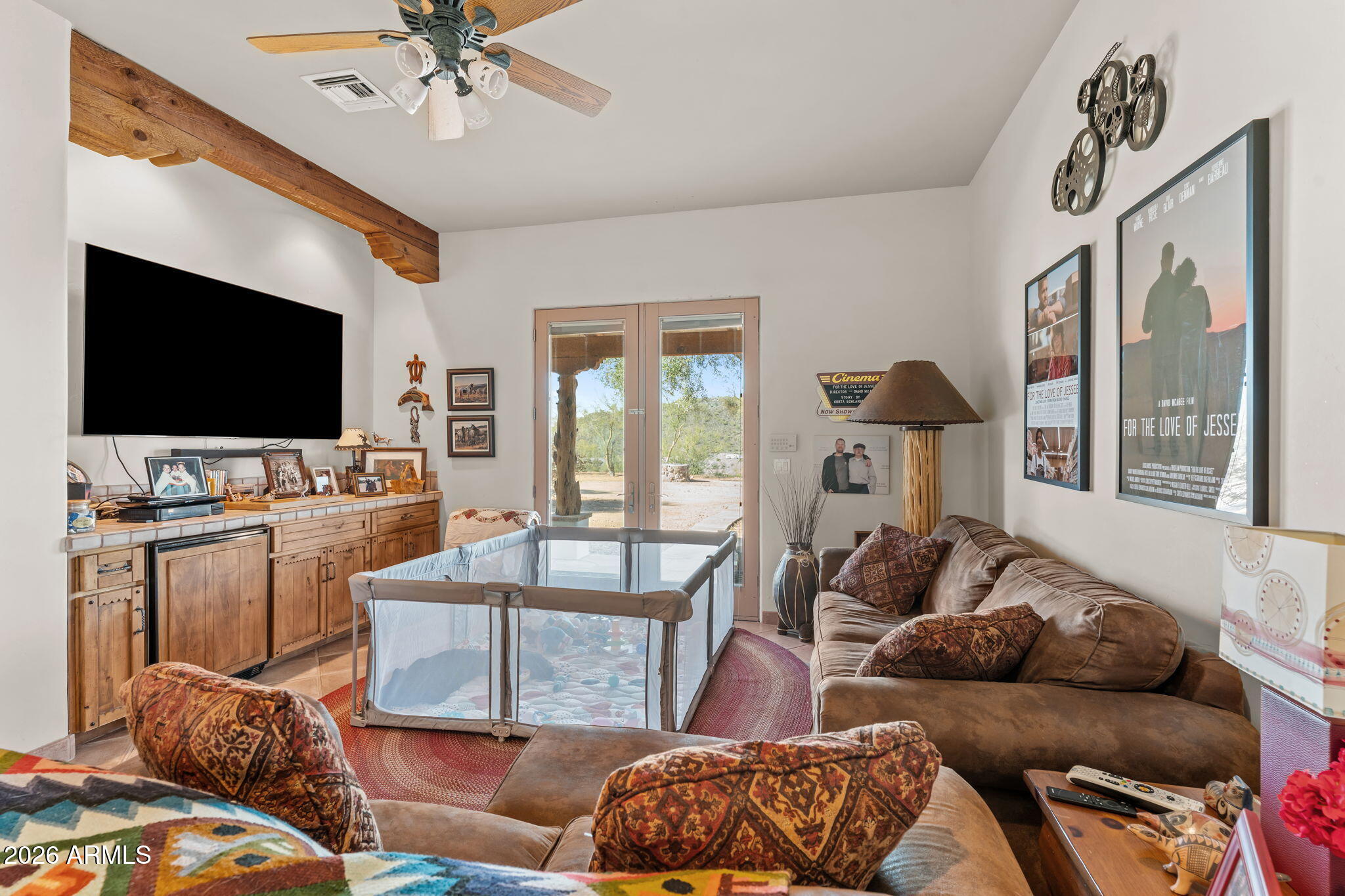 18210 Moonlight Mesa Road Wickenburg, AZ 85390 - Photo 35 of 141 a living room with furniture and a flat screen tv