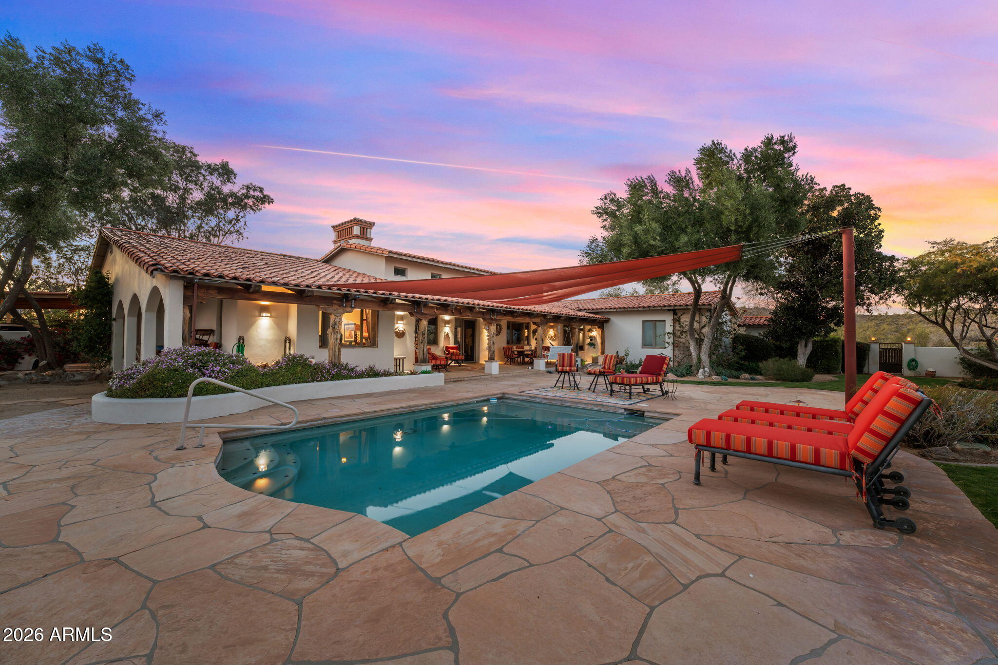 18210 Moonlight Mesa Road Wickenburg, AZ 85390 - Photo 40 of 141 a view of house with swimming pool and sitting area