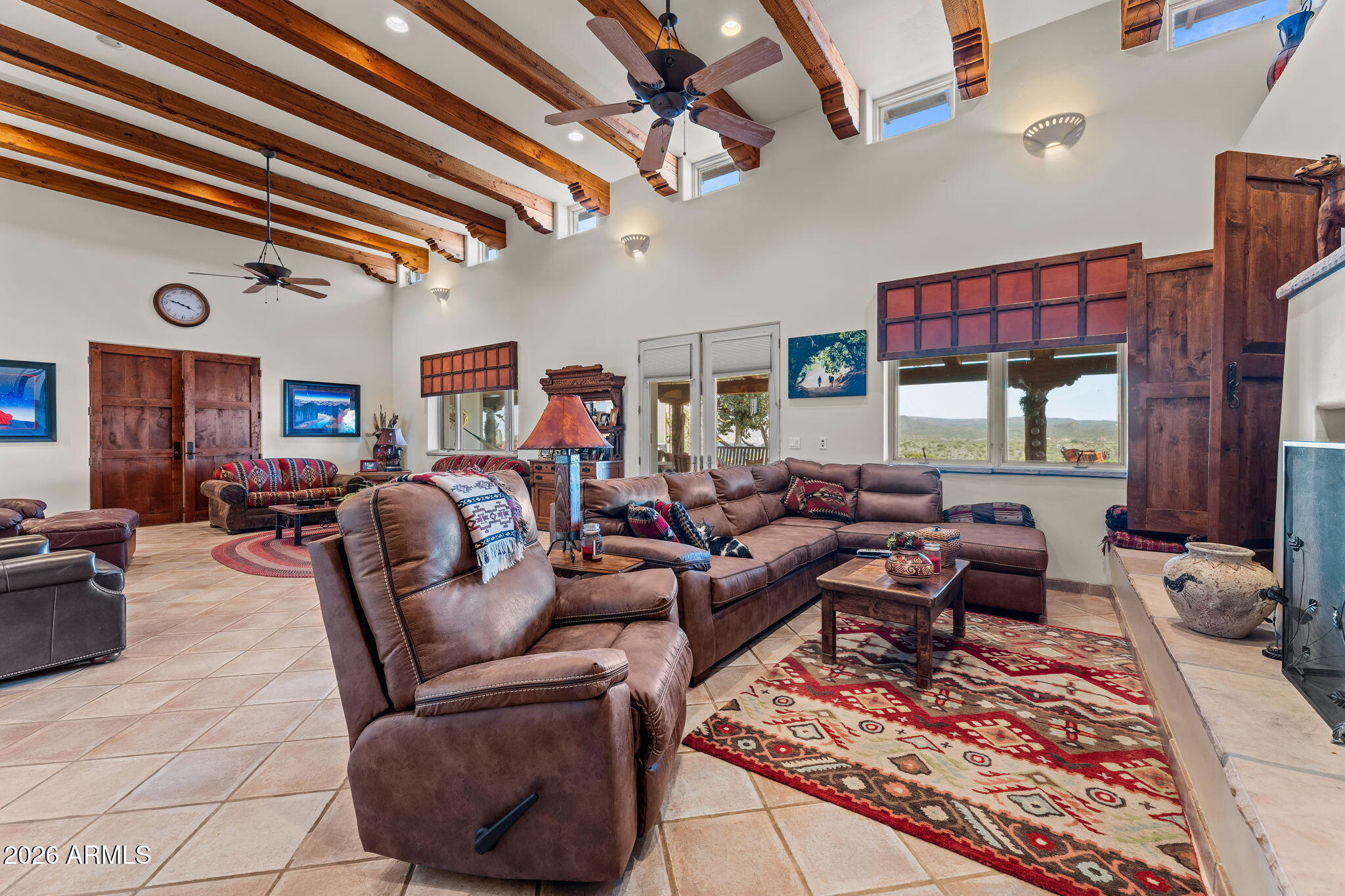 18210 Moonlight Mesa Road Wickenburg, AZ 85390 - Photo 6 of 141 a living room with furniture and a rug
