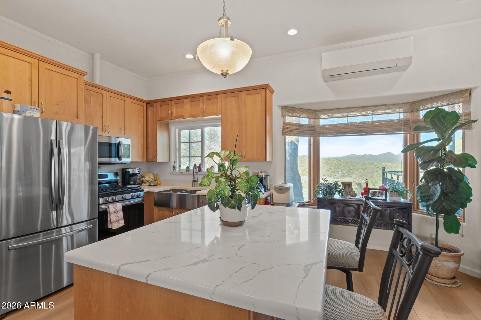 18210 Moonlight Mesa Road Wickenburg, AZ 85390 - Photo 69 of 141 a view of a dining room with furniture a potted plant and a large window
