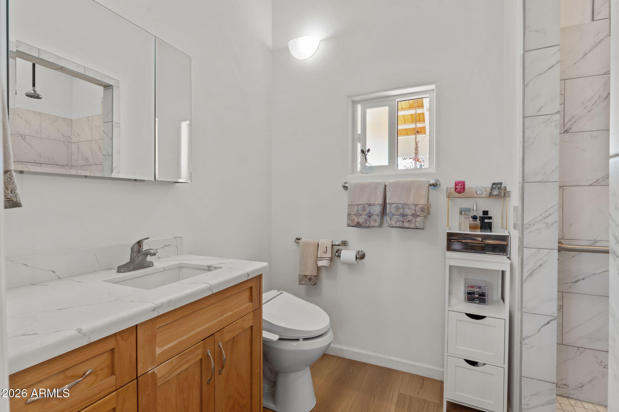 18210 Moonlight Mesa Road Wickenburg, AZ 85390 - Photo 83 of 141 a bathroom with a sink a toilet and vanity