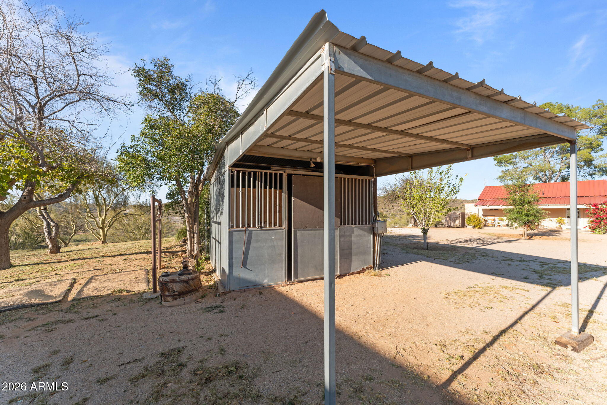 18210 Moonlight Mesa Road Wickenburg, AZ 85390 - Photo 100 of 141 a view of a house with backyard and a trees