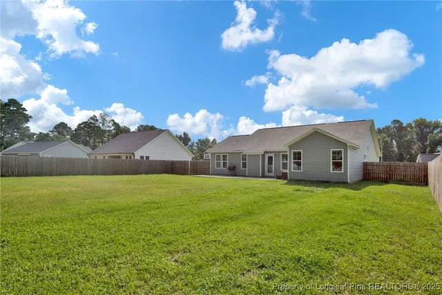 a front view of a house with yard