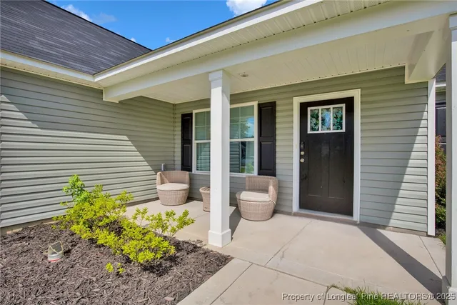 a front view of a house with fountain