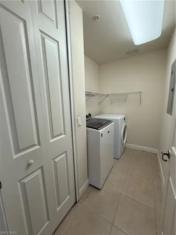 a utility room with a sink a washer and dryer