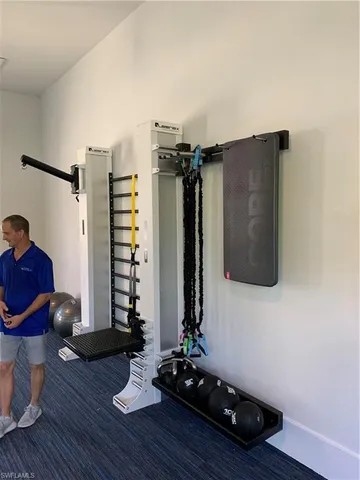 a table and chairs in wooden floor