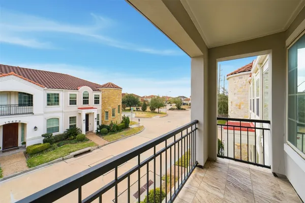 a view of a balcony with city view