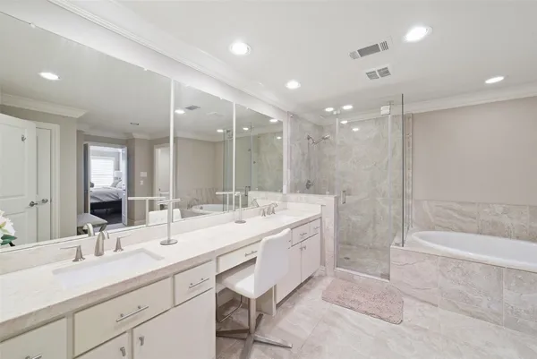 a bathroom with a double vanity sink mirror double and shower