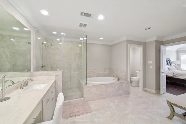 a bathroom with a bathtub shower sink and toilet