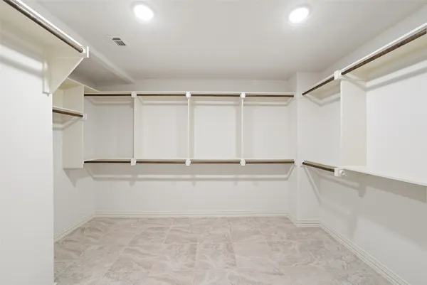 a view of an empty walk in closet