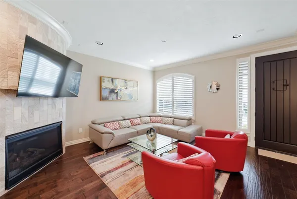 a living room with furniture fireplace and a flat screen tv