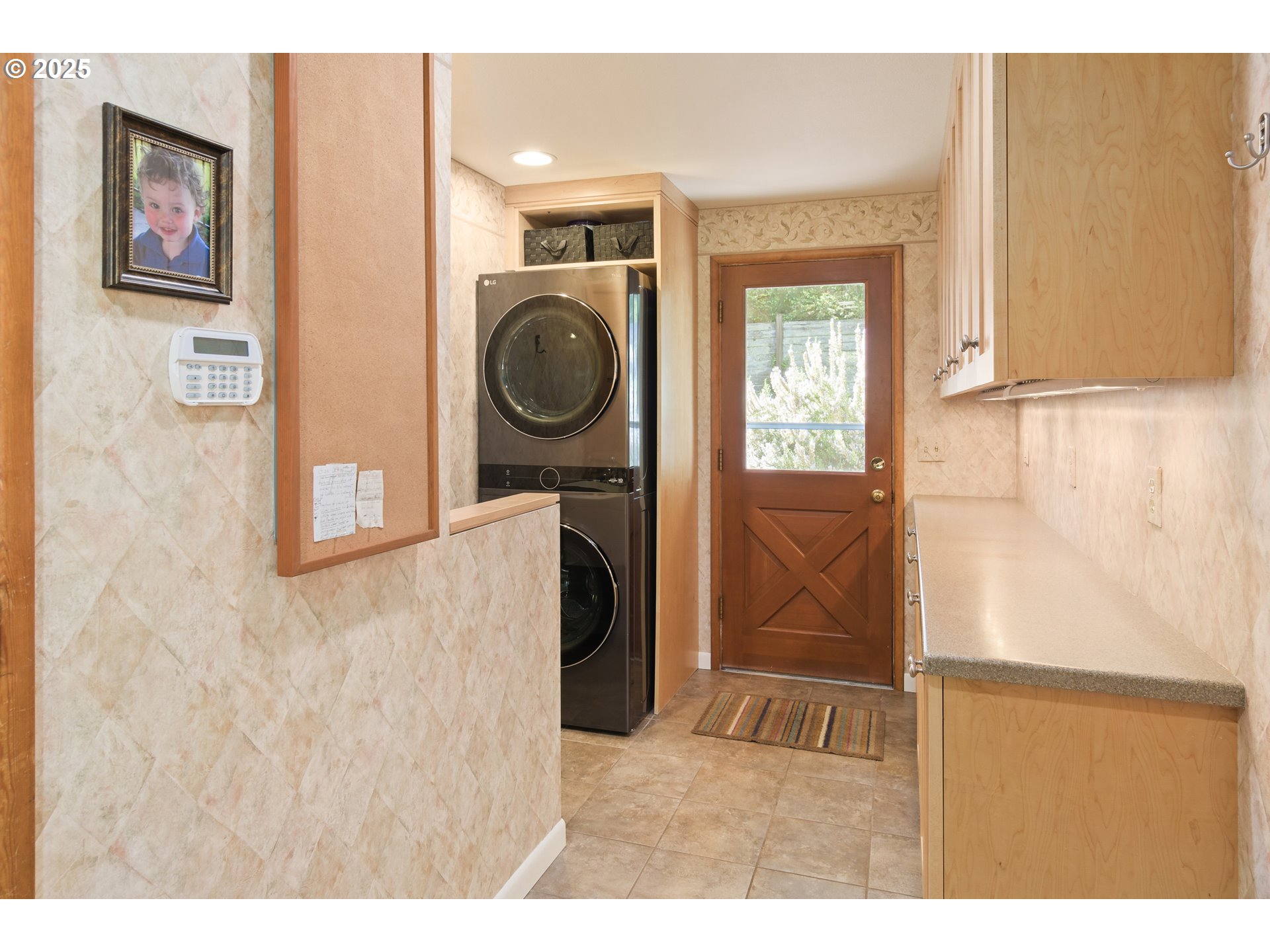 888 Crest Drive Eugene, OR 97405 - Photo 14 of 48 a view of a hallway with washer and dryer