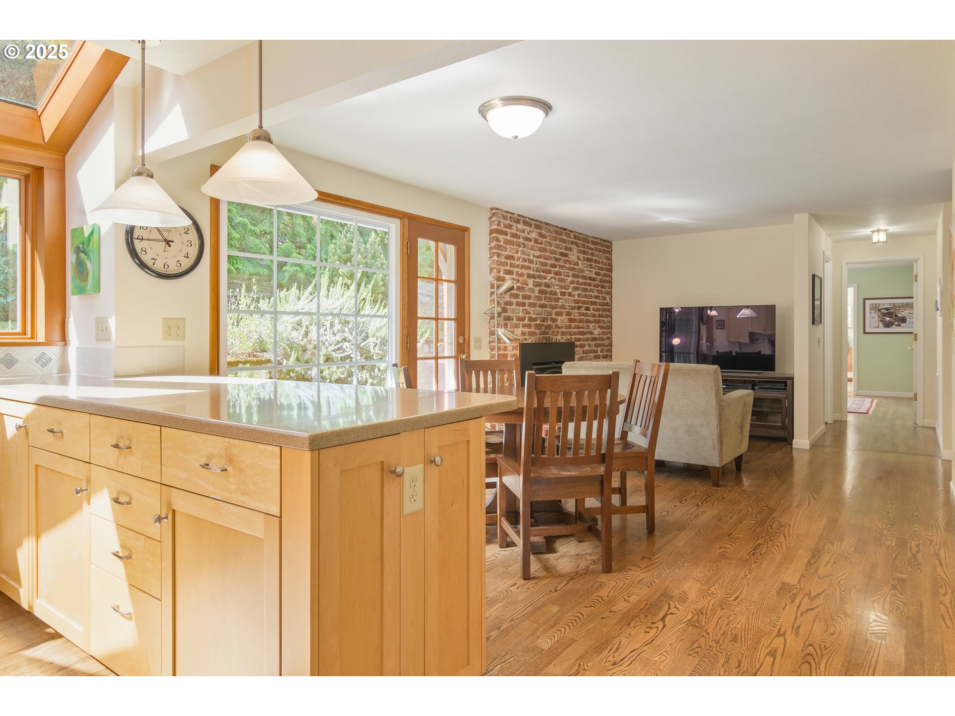 888 Crest Drive Eugene, OR 97405 - Photo 15 of 48 a dining room with furniture a chandelier and wooden floor