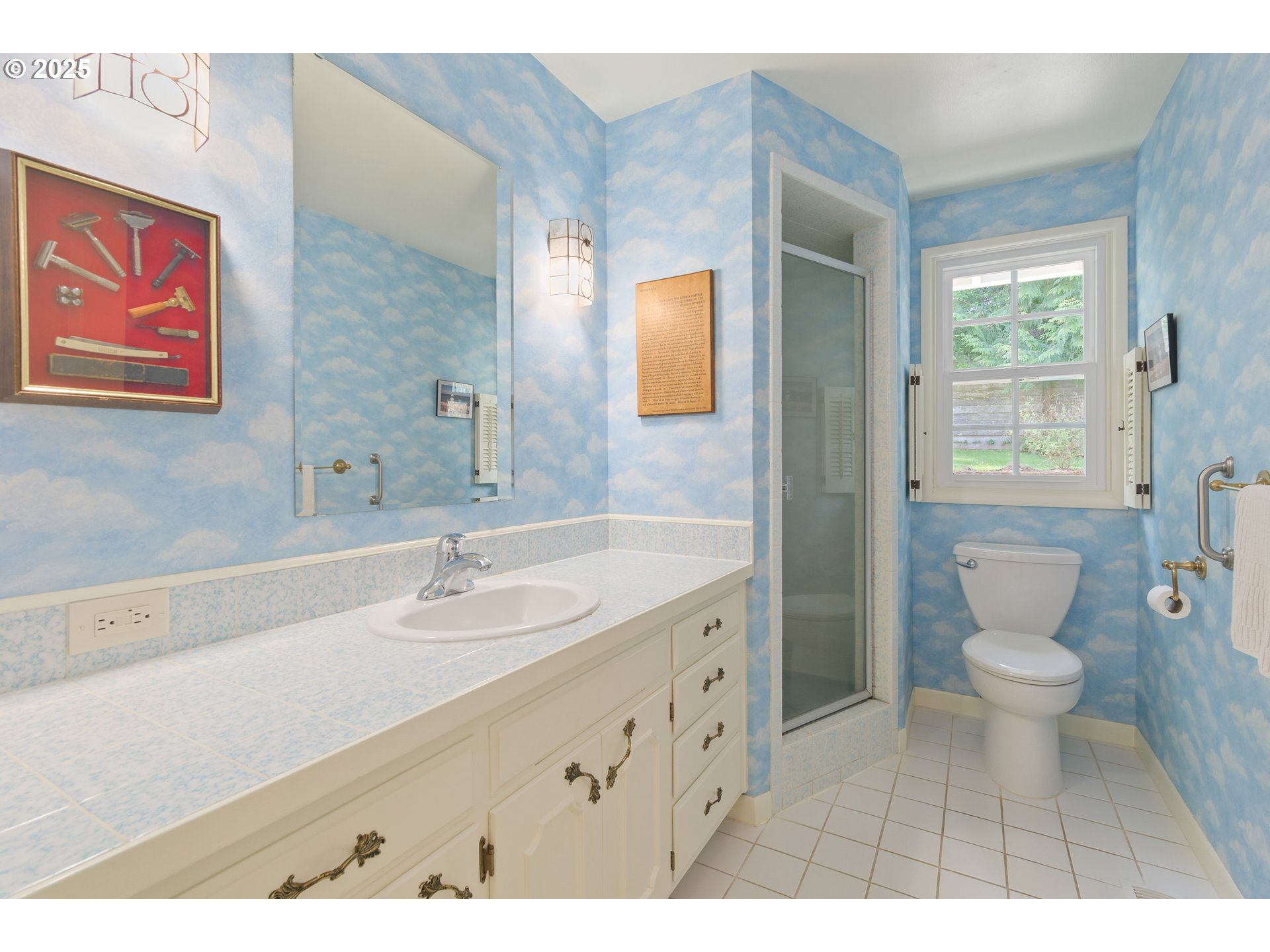 888 Crest Drive Eugene, OR 97405 - Photo 16 of 48 a bathroom with a sink and a mirror