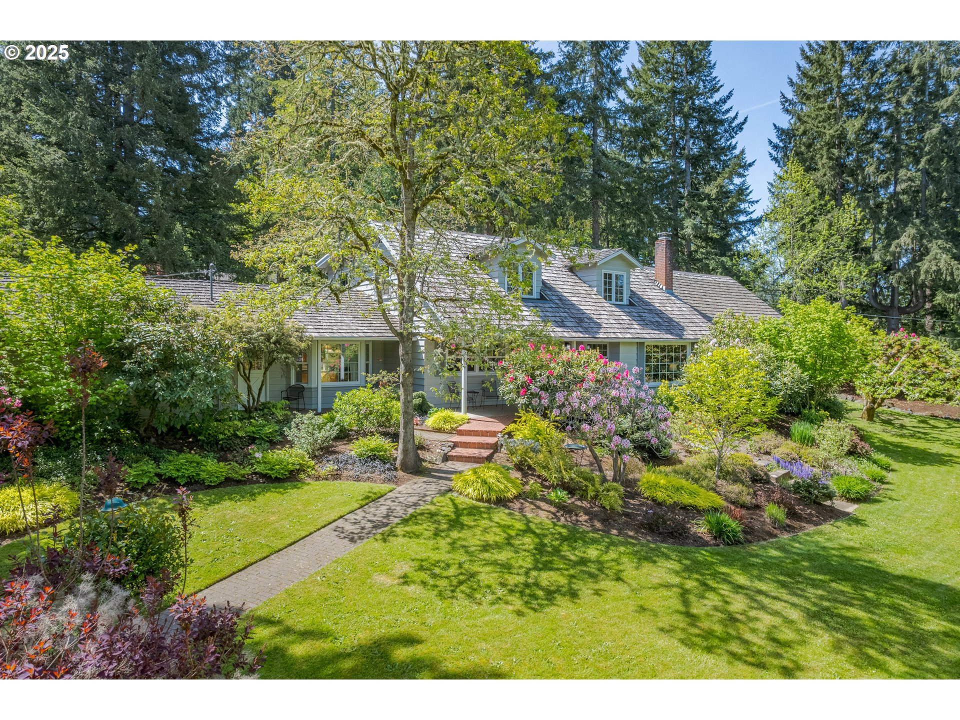 888 Crest Drive Eugene, OR 97405 - Photo 2 of 48 a view of a house with a backyard and sitting area
