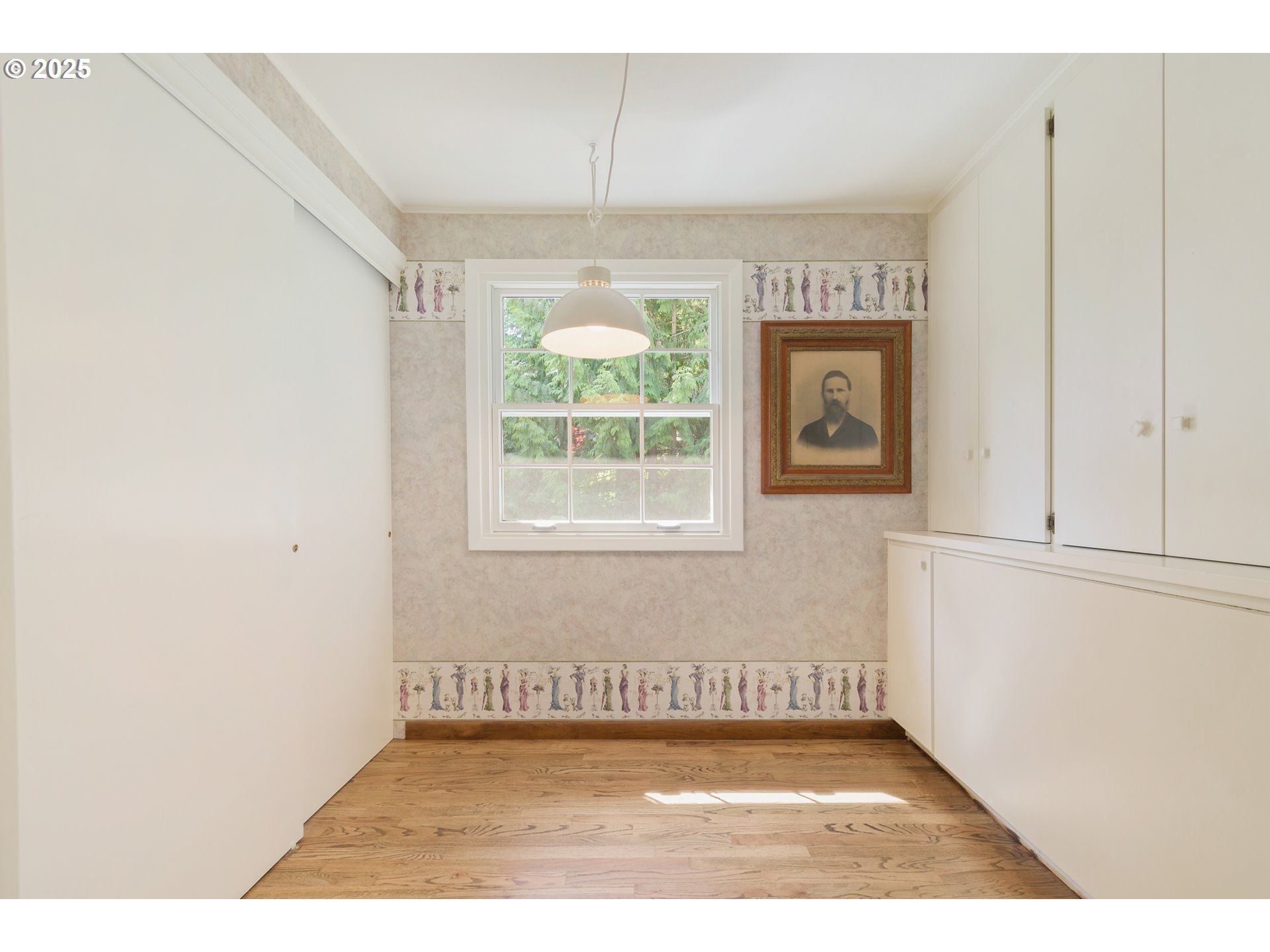 888 Crest Drive Eugene, OR 97405 - Photo 30 of 48 a view of a livingroom with wooden floor and a window
