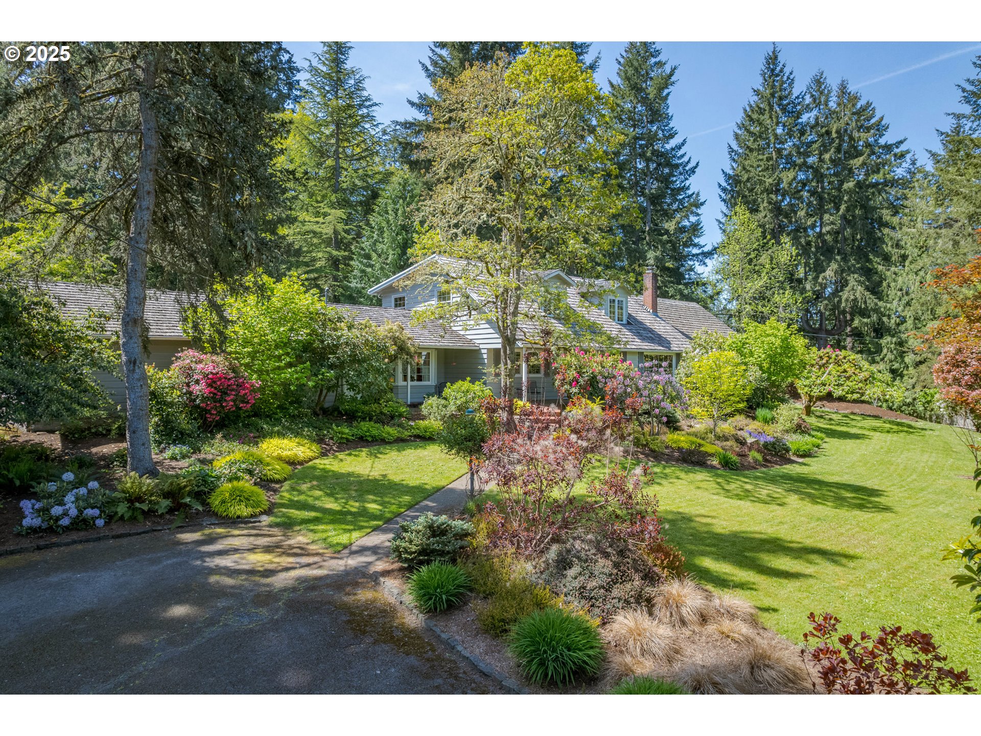 888 Crest Drive Eugene, OR 97405 - Photo 43 of 48 a view of a garden with plants