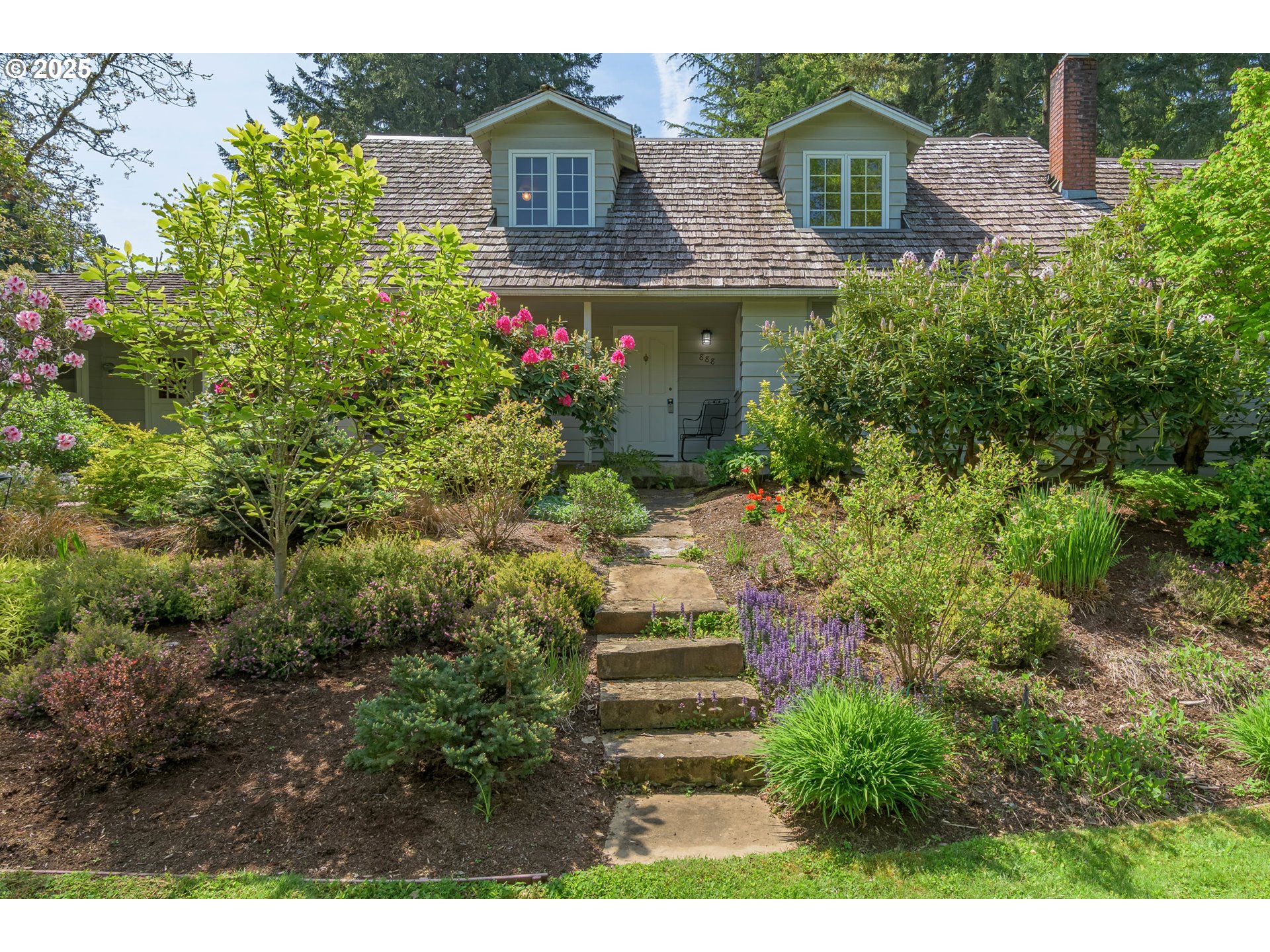 888 Crest Drive Eugene, OR 97405 - Photo 48 of 48 a front view of a house with a yard
