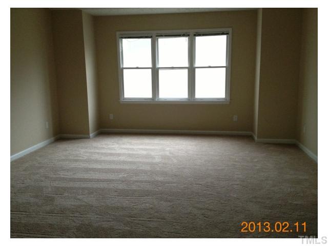 6617 Hammersmith Drive Raleigh, NC 27613 - Photo 8 of 13 a view of an empty room with a window