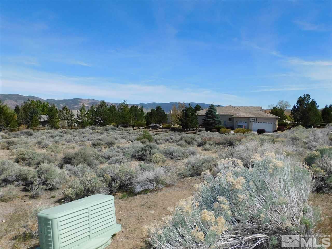 1295 Wolf Run Road Reno, NV 89511 - Photo 6 of 7 a view of a dry yard with wooden fence