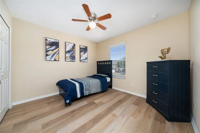 a bedroom with a bed and a dresser