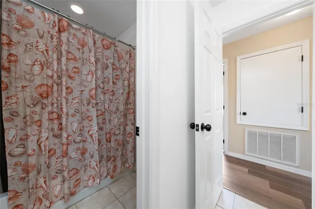 a bathroom with a shower curtain