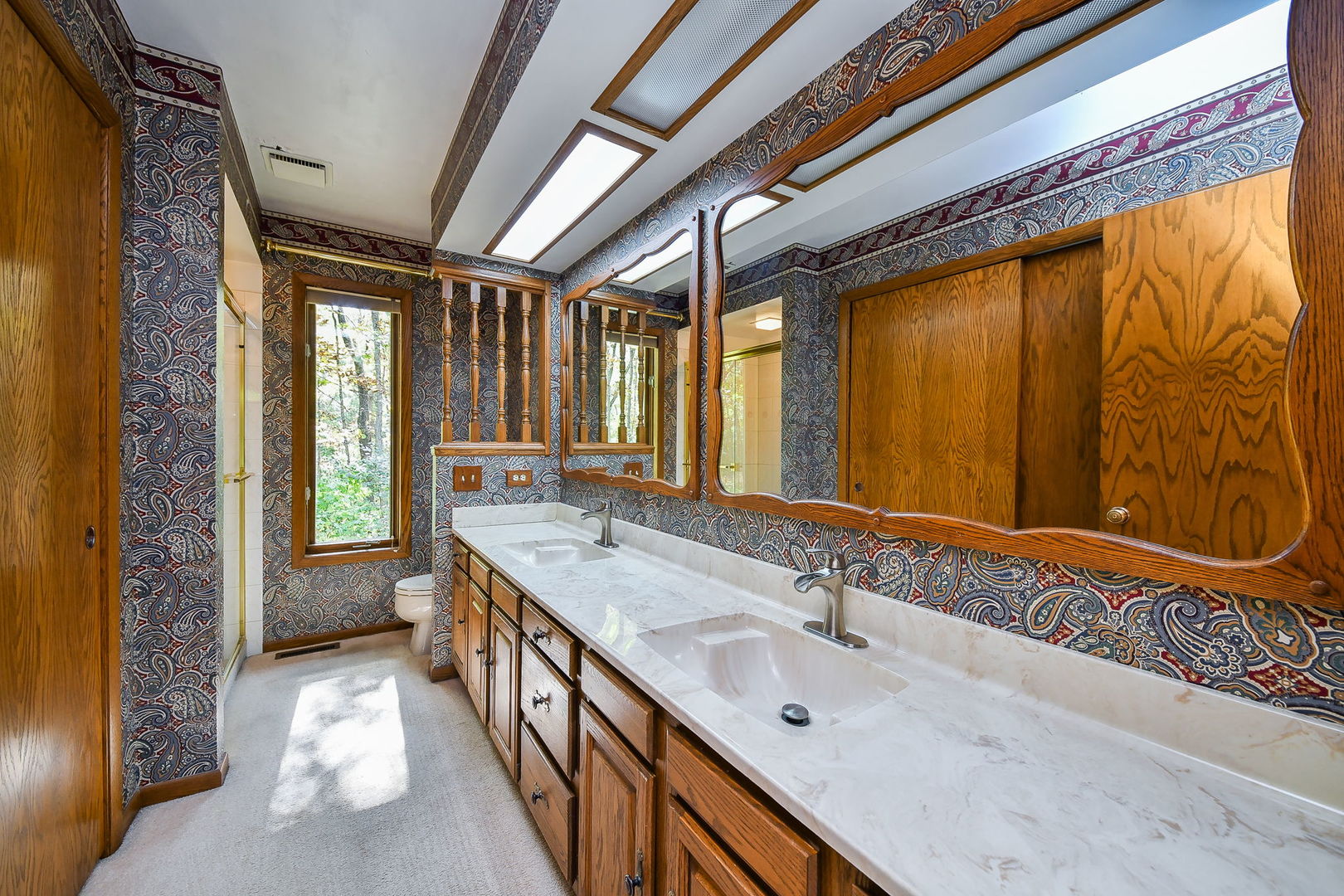6N347 Old Homestead Road St. Charles, IL 60175 - Photo 15 of 25 a bathroom with a double vanity sink and a large mirror