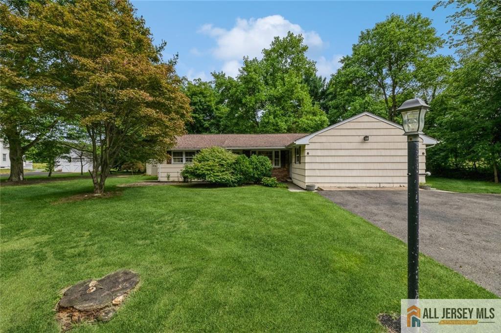 129 Cottrell Road Old Bridge, NJ 07747 - Photo 1 of 25 a front view of a house with a yard