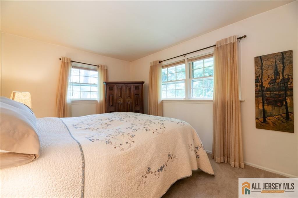 129 Cottrell Road Old Bridge, NJ 07747 - Photo 12 of 25 a bedroom with a bed and a window