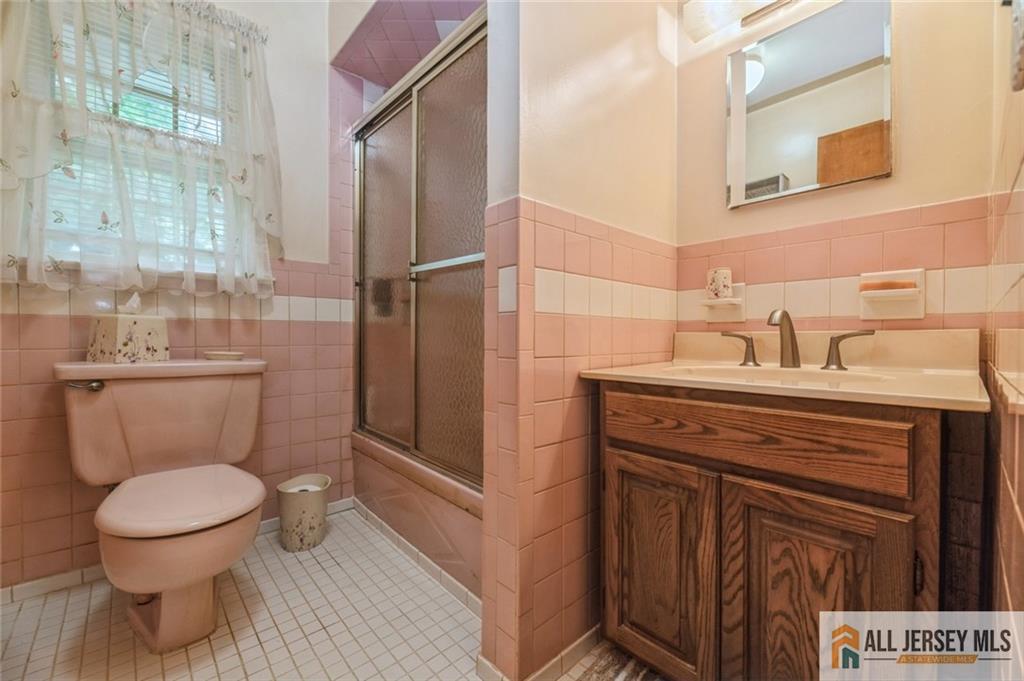 129 Cottrell Road Old Bridge, NJ 07747 - Photo 15 of 25 a bathroom with a toilet sink and a shower