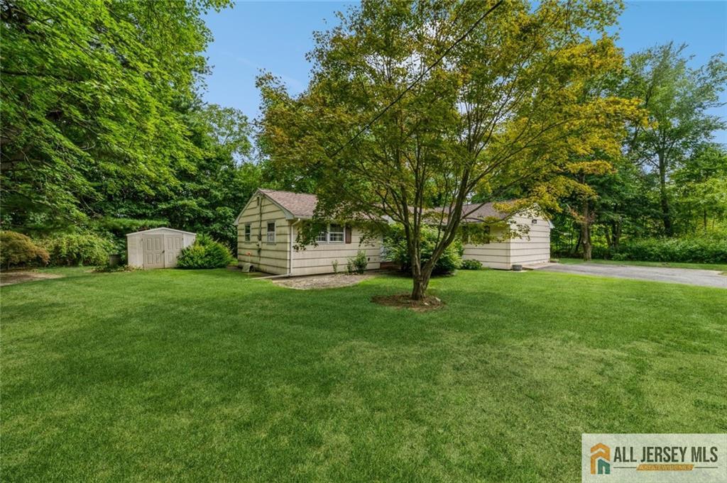 129 Cottrell Road Old Bridge, NJ 07747 - Photo 20 of 25 a front view of a house with a yard