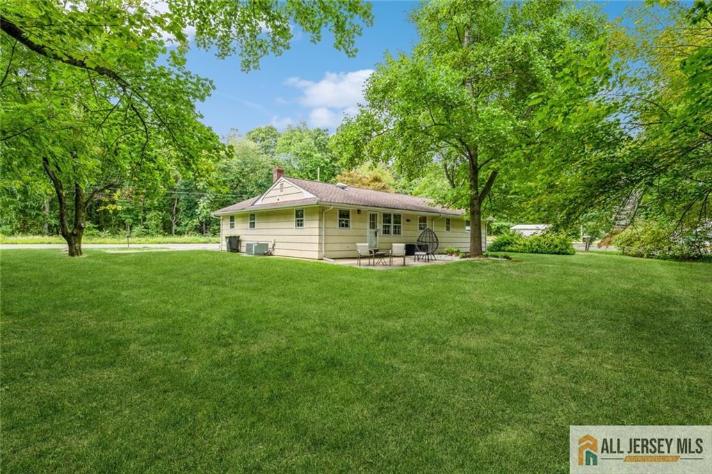 129 Cottrell Road Old Bridge, NJ 07747 - Photo 2 of 25 a front view of a house with a yard