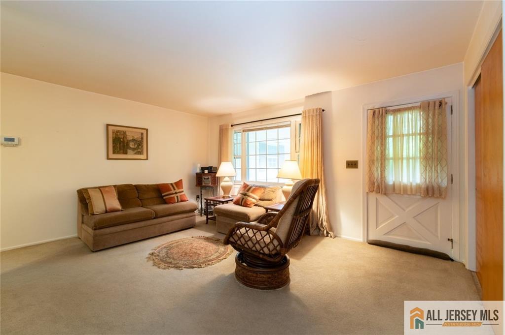 129 Cottrell Road Old Bridge, NJ 07747 - Photo 4 of 25 a living room with furniture and a window