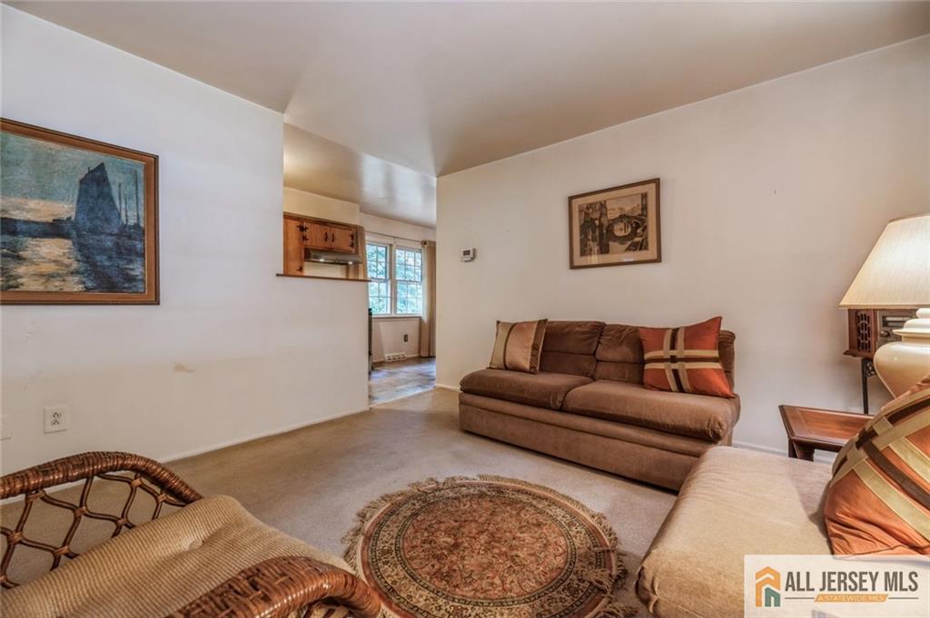 129 Cottrell Road Old Bridge, NJ 07747 - Photo 5 of 25 a living room with furniture and a wooden floor