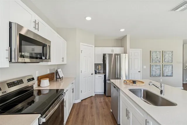 a living room with furniture and a lamp