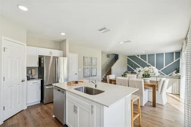 a living room with furniture and a lamp
