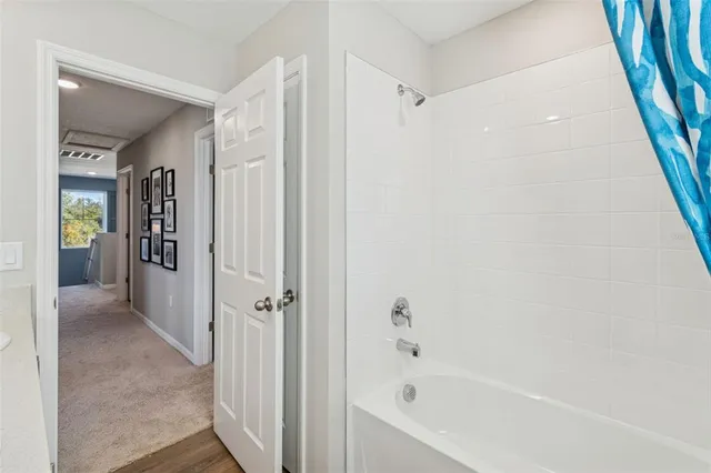 a bathroom with a sink double vanity and a mirror