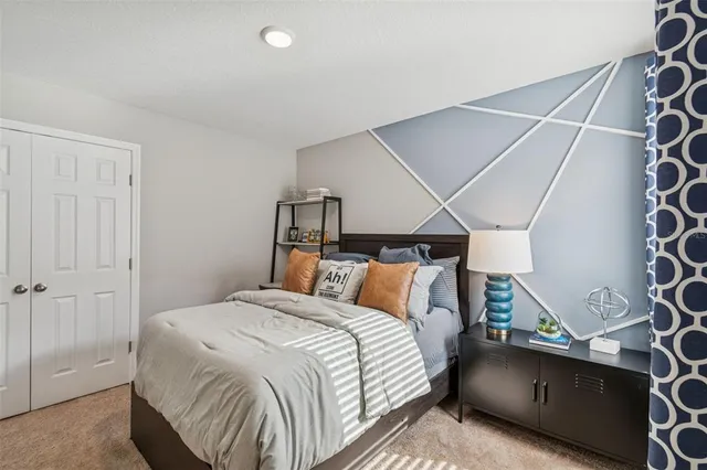 a bathroom with a granite countertop sink a mirror a vanity and a shower