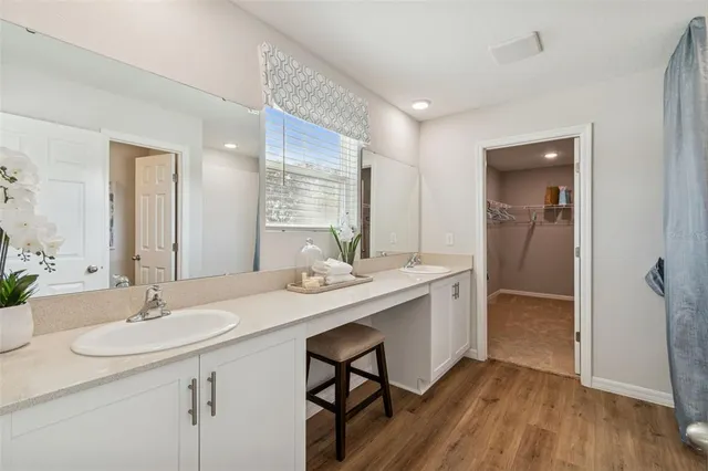 a view of a lake with a table and chairs