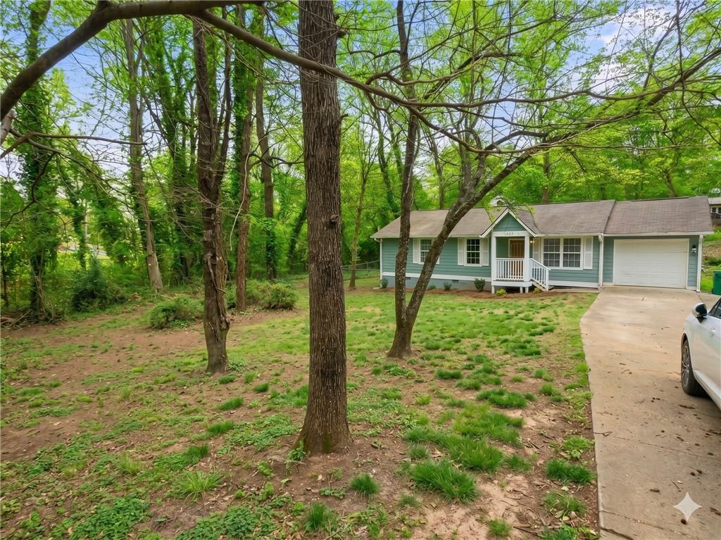 1929 Wee Kirk Road Southeast Atlanta, GA 30316 - Photo 20 of 22 a backyard of a house with lots of green space