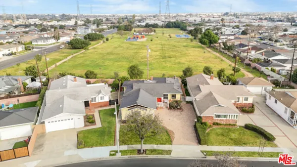 an aerial view of residential houses with outdoor space